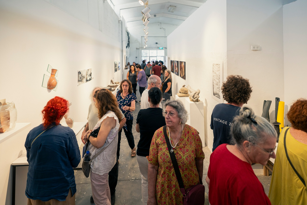 people browsing in an art gallery