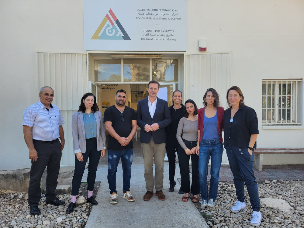 Givat Haviva staff with german ambassador in front of the joint art gallery