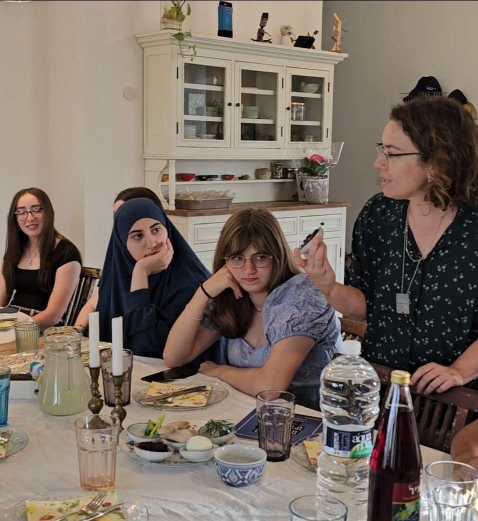 Youth sitting at a table during a passover seder